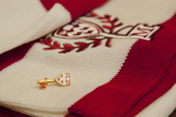 scarlet key pin on sweater