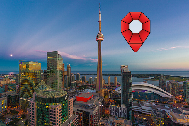 Toronto city skyline with pinpoint logo in corner